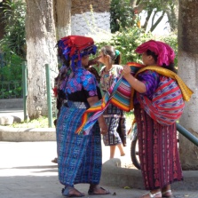 Women sell scarves in the Central Park located in Antigua, Guatemala
